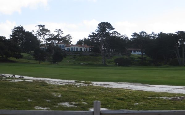 Professional golf tournament with players competing on green course