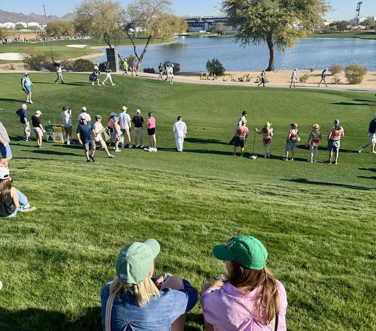 Golf course green fairway during major tournament with spectators watching