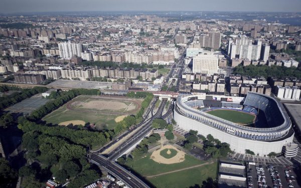 Aerial view of NFL stadium with full crowd during regular season game